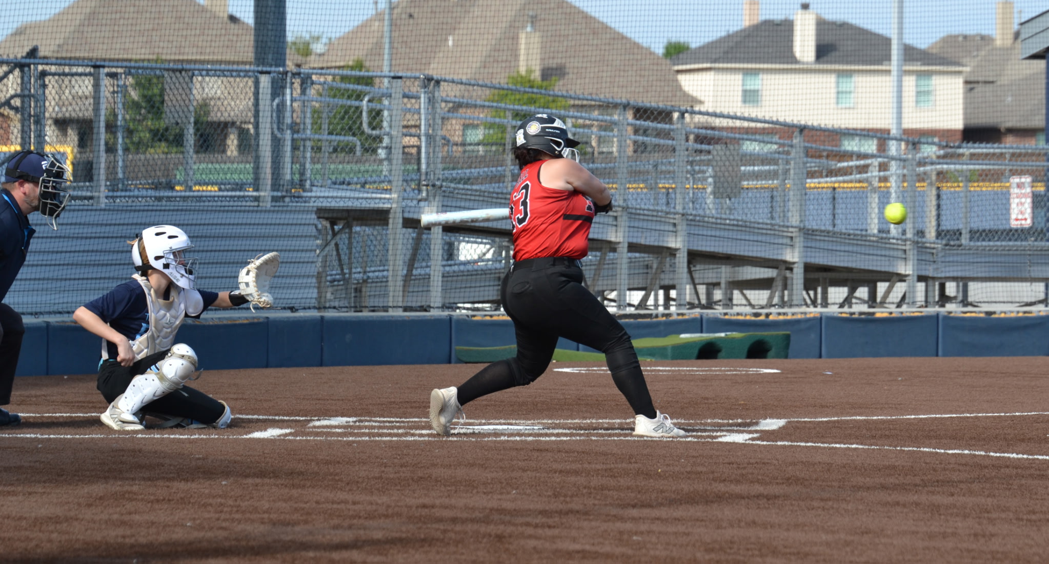 Shannon in softball uniform